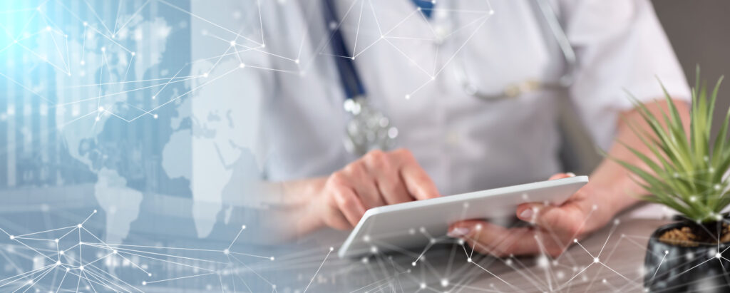 Female doctor using digital tablet; panoramic banner