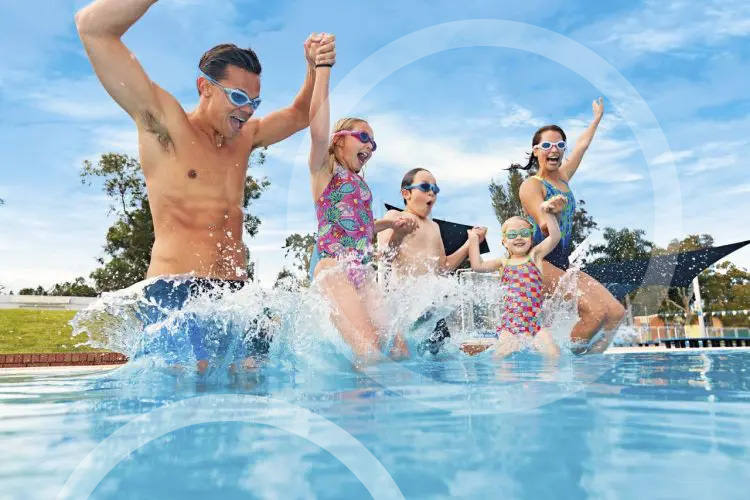 Family diving in swimming pool