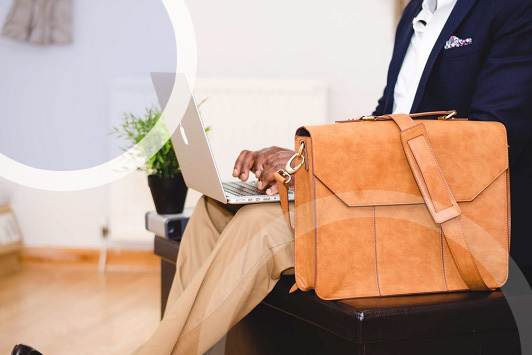 man with laptop and briefcase