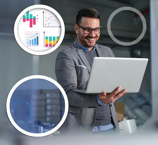 business man in suite and glasses, holding laptop