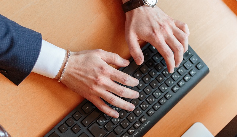 businessman typing on keyboard