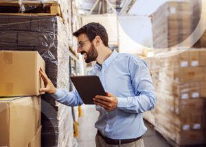 man with tablet cheking the warehouse