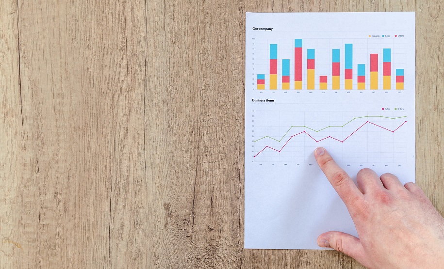 man pointing to growth chart