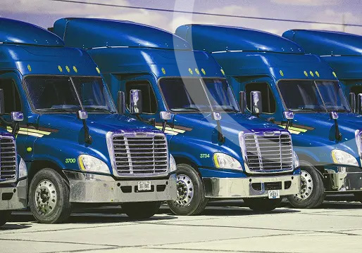 blue semi-trucks lined up