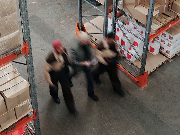walking through warehouse